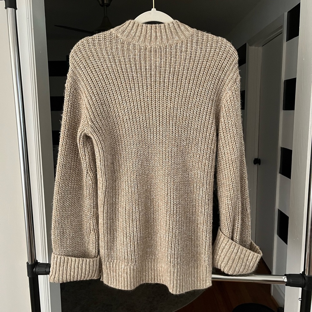 Tan chunky sweater with folded sleeves